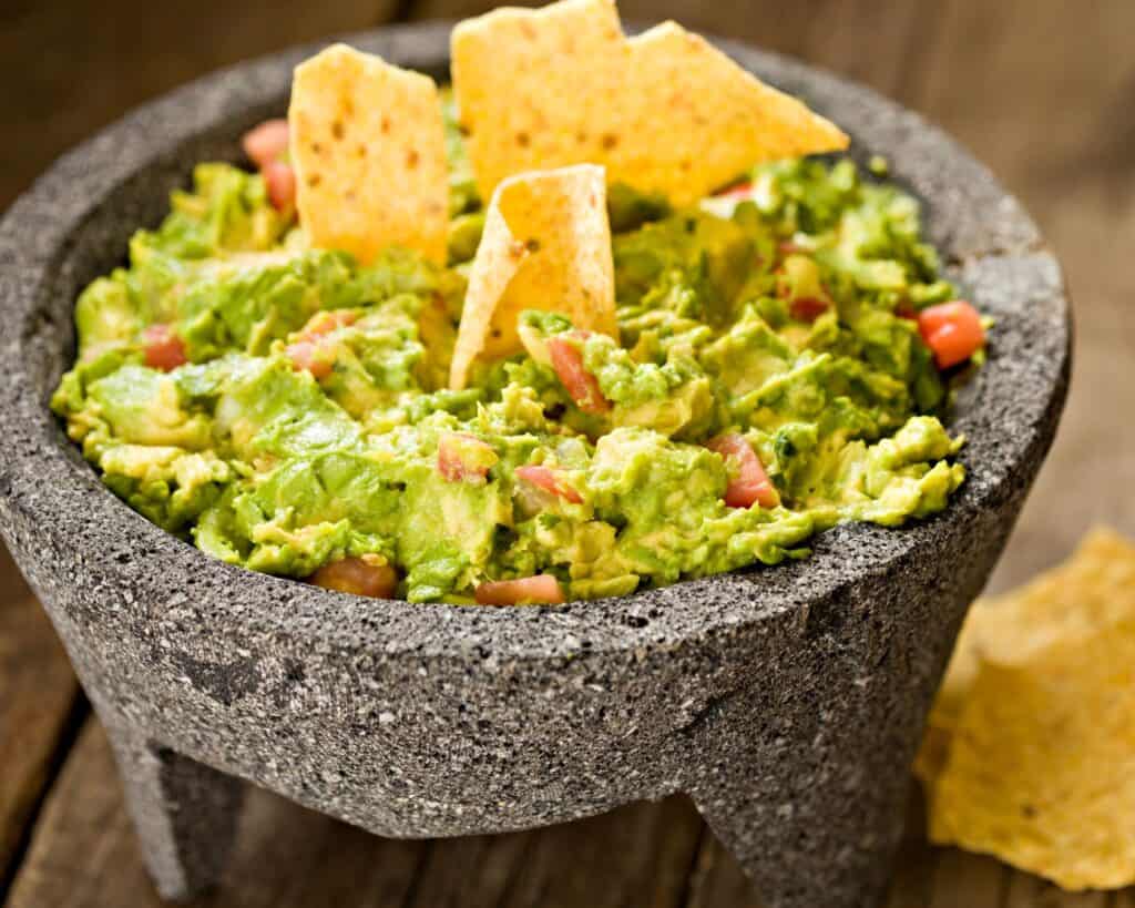 foods that begin with G: guacamole in a mortar