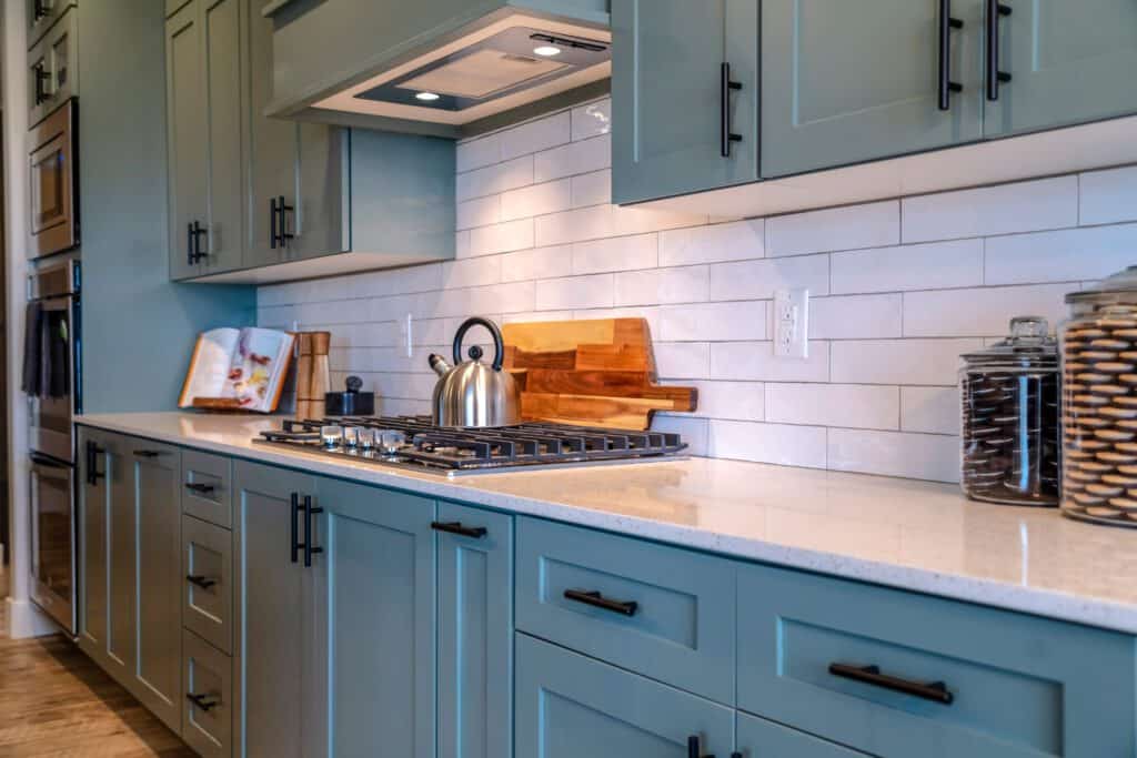 light gray blue kitchen with white counter